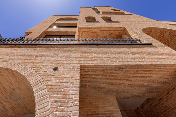 Brick facade under the roof with rustic brick